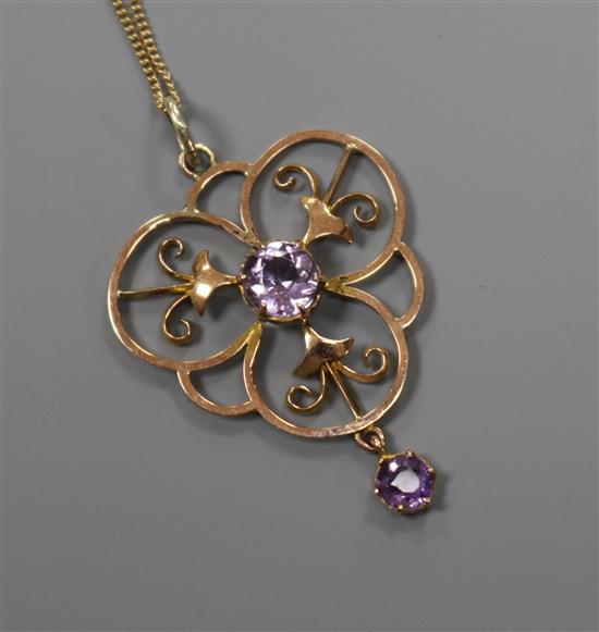 A 9ct gold and amethyst set open work pendant, on a 9ct gold fine link chain, pendant 38mm.